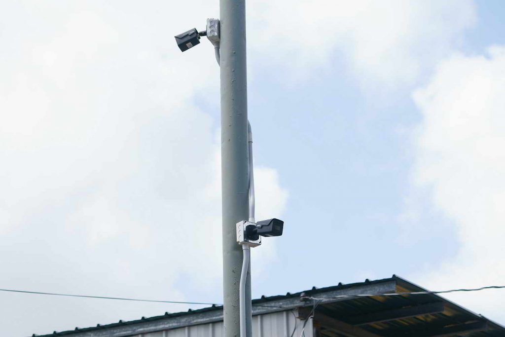 Photos showing security cameras at the entrance of Red Head Trace.