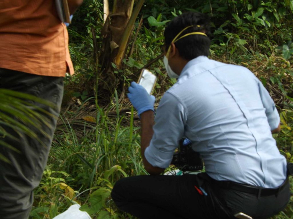 Cellphone being recovered by police investigators